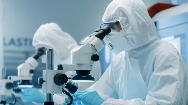A professional working in a state-of-the-art life sciences laboratory